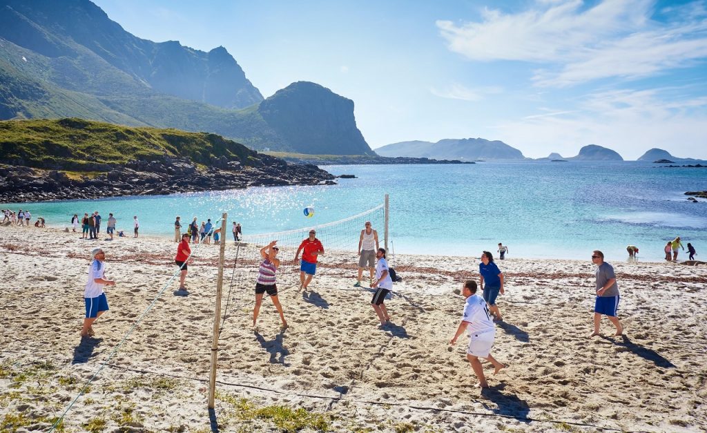 Playing volleyball at Hovden beach in Lofoten