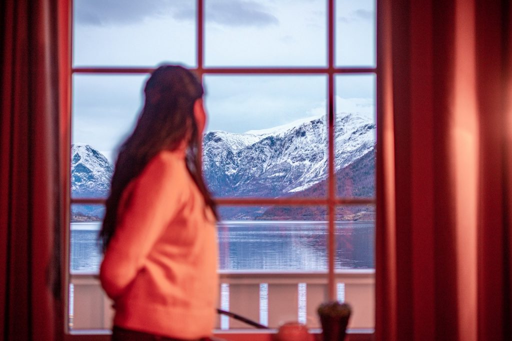 Woman looking out at the Flåm fjord